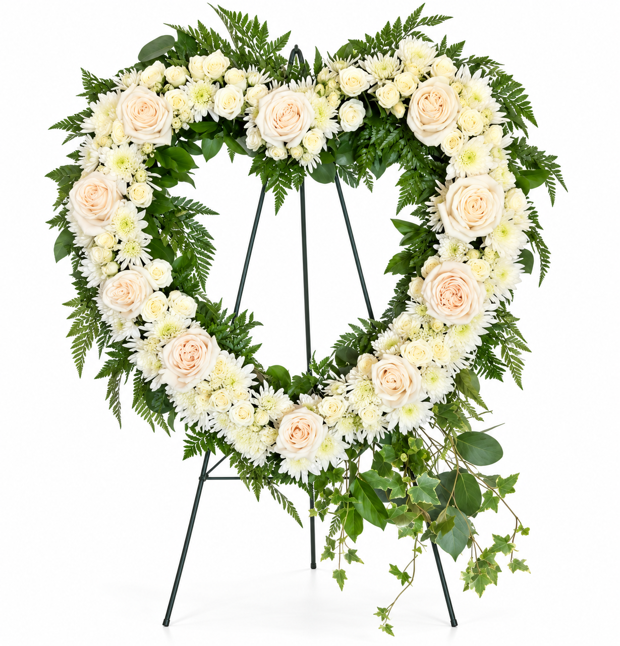 Forever in Our Hearts heart-shaped funeral wreath featuring ivory roses, white chrysanthemums, and cascading greenery displayed on a standing easel by Sassafraz Flowers, Galena, Ohio.